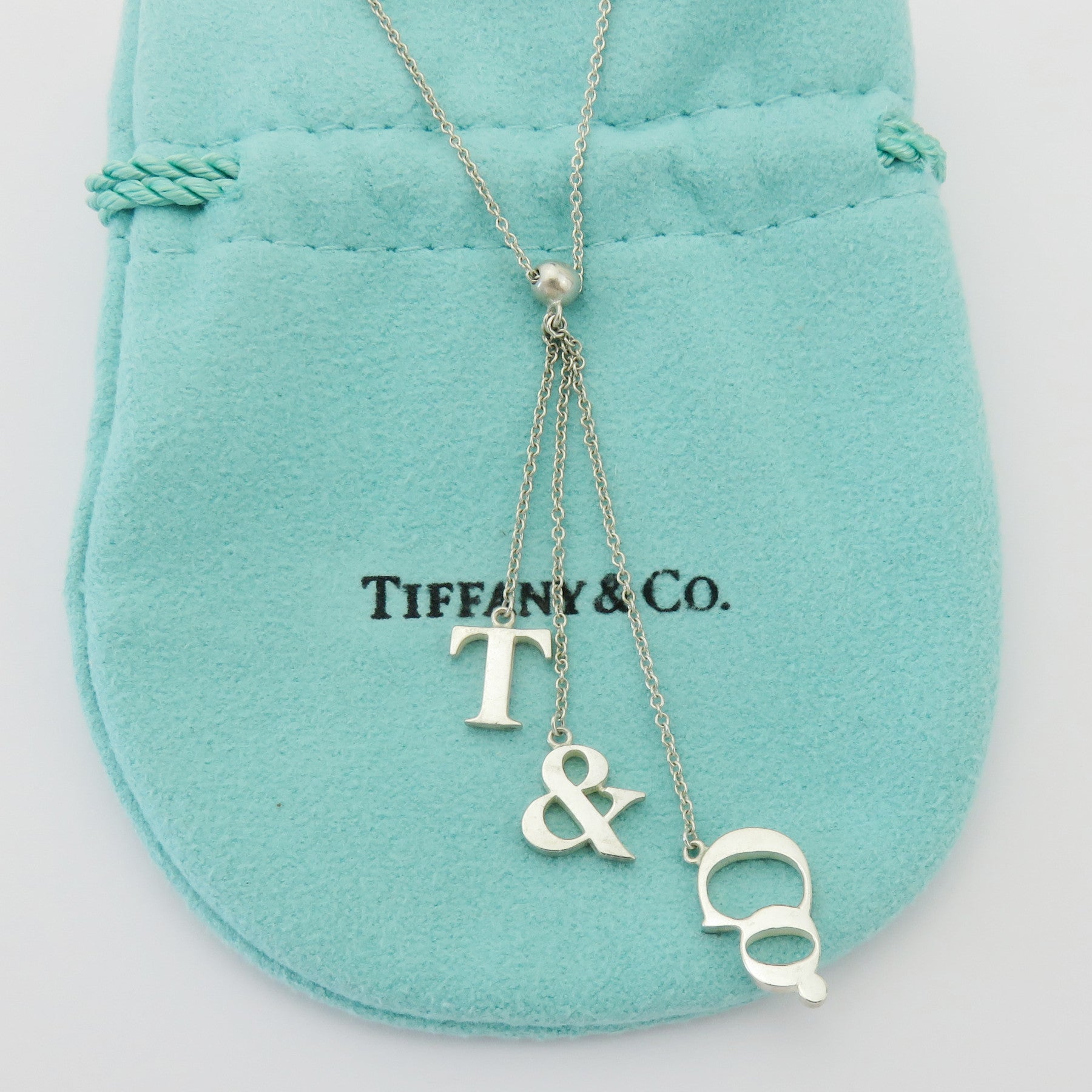 TIFFANY & CO 925 Sterling Silver T & CO Dangle Pendant Necklace with Pouch