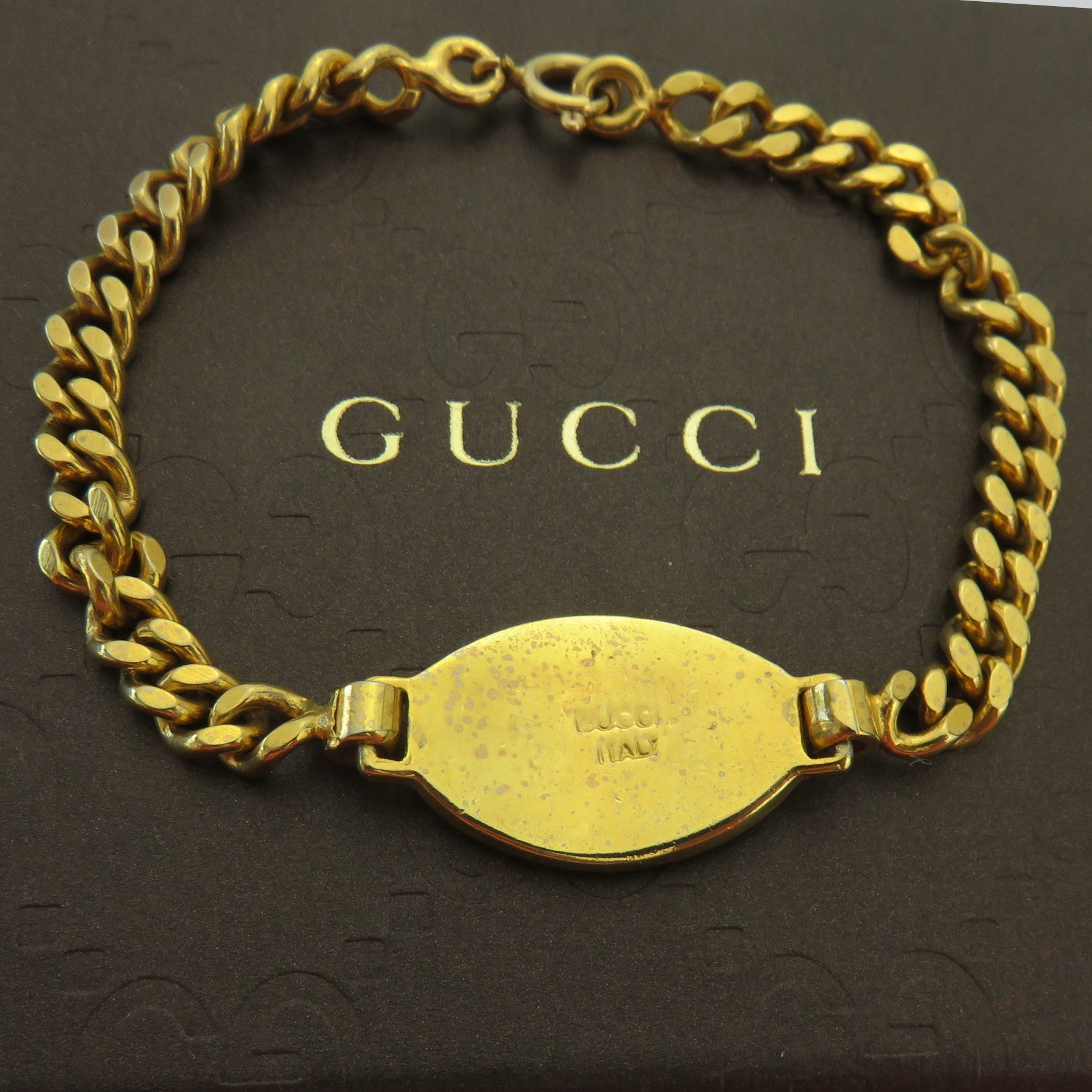 Gucci Vintage Gold Tone Metal Red Oval Tag Bracelet