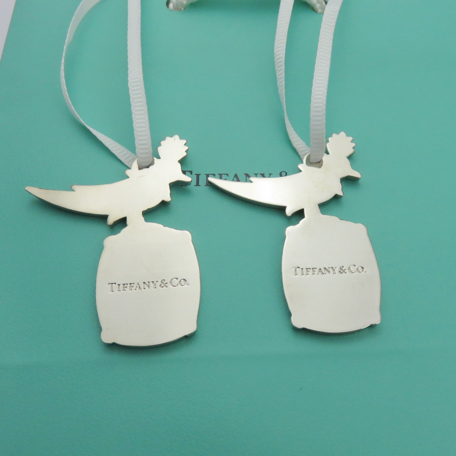 2x Tiffany & Co. Bird on a Rock Charms Polished Silver Tone Metal Set + Bag