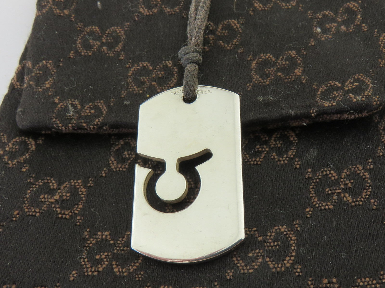 Gucci Sterling Silver Taurus Pendant Brown Cord Unisex Pendant Necklace