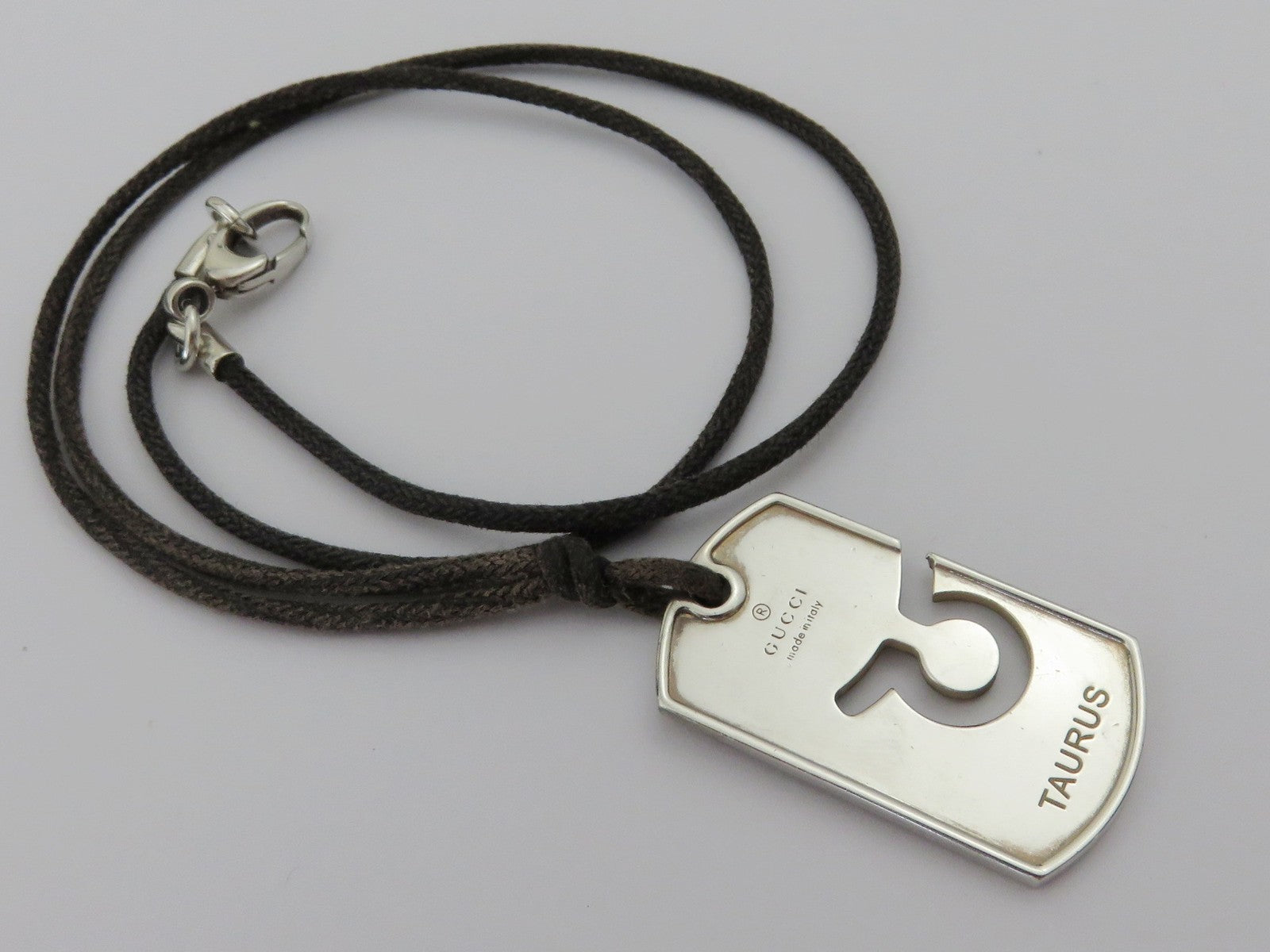 Gucci Sterling Silver Taurus Pendant Brown Cord Unisex Pendant Necklace