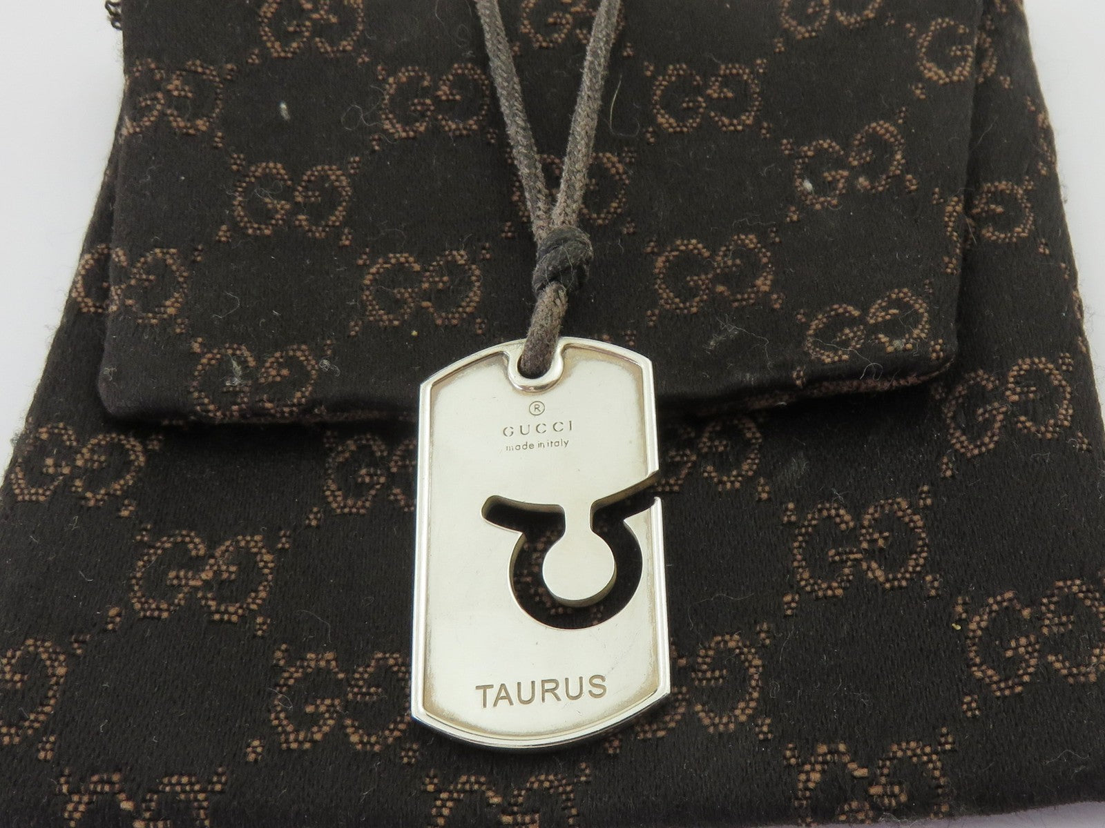 Gucci Sterling Silver Taurus Pendant Brown Cord Unisex Pendant Necklace